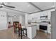 Modern kitchen featuring granite countertops, stainless steel appliances, and island seating at 1300 Conrad Dr, New Smyrna Beach, FL 32168
