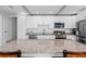 Bright kitchen with stainless steel appliances, granite countertops, and a large island at 1300 Conrad Dr, New Smyrna Beach, FL 32168