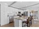 Bright kitchen featuring granite countertops, stainless appliances, and a functional island at 1300 Conrad Dr, New Smyrna Beach, FL 32168