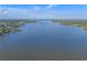Scenic view of waterfront with beautiful blue skies and lush landscapes surrounding the water at 1300 Conrad Dr, New Smyrna Beach, FL 32168