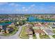 Aerial view of homes by a lake in a suburban neighborhood at 1515 Angler Ave, Kissimmee, FL 34746