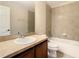 Bathroom with a single sink vanity, tile flooring, and a shower-tub combo with tile surround at 1515 Angler Ave, Kissimmee, FL 34746