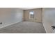 Comfortable bedroom with neutral walls, plush carpet, window, and white trim at 1515 Angler Ave, Kissimmee, FL 34746