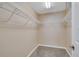 Walk-in closet features neutral walls, carpeted floor, and wire shelving at 1515 Angler Ave, Kissimmee, FL 34746