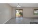 Open dining area with tile flooring, natural light, and sliding door access to the lanai at 1515 Angler Ave, Kissimmee, FL 34746