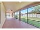 Large screened porch with a ceiling fan overlooking the backyard and providing an outdoor living space at 1515 Angler Ave, Kissimmee, FL 34746