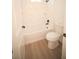Bathroom featuring tub with tile surround, modern hardware, and updated plumbing at 15215 Sw 43Rd Ct, Ocala, FL 34473