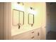 Bathroom featuring double sinks, modern hardware, and updated lighting at 15215 Sw 43Rd Ct, Ocala, FL 34473
