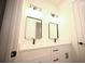 Bright bathroom features a double vanity, modern lighting, and sleek black fixtures at 15215 Sw 43Rd Ct, Ocala, FL 34473