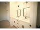 Bathroom featuring double sinks, modern hardware, and updated lighting at 15215 Sw 43Rd Ct, Ocala, FL 34473