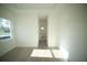Bedroom with light hardwood floors and a view into an adjacent bathroom at 15215 Sw 43Rd Ct, Ocala, FL 34473