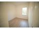 Bedroom featuring hardwood floors, a neutral paint palette, and a window at 15215 Sw 43Rd Ct, Ocala, FL 34473