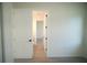 Hallway leading to other rooms in the house with white doors and trim at 15215 Sw 43Rd Ct, Ocala, FL 34473