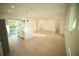 Well-lit kitchen featuring white cabinets, stainless steel appliances, island, and sliding glass door at 15215 Sw 43Rd Ct, Ocala, FL 34473