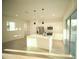 Bright kitchen featuring white cabinets, stainless steel appliances, and a large center island at 15215 Sw 43Rd Ct, Ocala, FL 34473