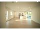 Spacious open living area features a modern kitchen with stainless steel appliances and wood flooring at 15215 Sw 43Rd Ct, Ocala, FL 34473