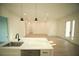 Open-concept living room with light wood floors, recessed lighting, and a view of the kitchen island at 15215 Sw 43Rd Ct, Ocala, FL 34473