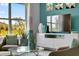 Cozy living room with accent wall, plush seating, and bright natural light at 1705 Three Bars Rd, Kissimmee, FL 34744