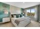 Stylish primary bedroom with decorative wall art and views of the outdoors at 1705 Three Bars Rd, Kissimmee, FL 34744