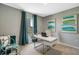 Bright home office with modern desk, comfortable seating, and decorative artwork at 1705 Three Bars Rd, Kissimmee, FL 34744