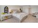 Bright bedroom showcasing a queen size bed with a shiplap wall and neutral accents at 1706 Three Bars Rd, Kissimmee, FL 34744