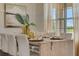Bright dining room with stylish decor, natural light, and a large table perfect for entertaining guests at 1706 Three Bars Rd, Kissimmee, FL 34744
