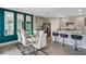 Dining area with stylish decor, modern furnishings, and an adjacent, fully-equipped kitchen at 1718 Three Bars Rd, Kissimmee, FL 34744