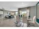 Dining area flows into living room, features white table with green accents, creating an inviting atmosphere at 1724 Three Bars Rd, Kissimmee, FL 34744