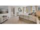 Bright bedroom featuring an accent chair, stylish curtains, and a comfortable bed at 1730 Three Bars Rd, Kissimmee, FL 34744