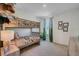 bedroom featuring a bunk bed, window with a nature view, and modern decor at 1730 Three Bars Rd, Kissimmee, FL 34744