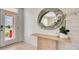 Stylish entryway with white shiplap walls, modern mirror, and tasteful decor at 1730 Three Bars Rd, Kissimmee, FL 34744