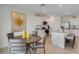Bright kitchen features stainless appliances, granite countertops, and adjacent dining area at 1730 Three Bars Rd, Kissimmee, FL 34744