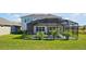 Enjoy outdoor living with this screened-in pool, patio and lush backyard at 1832 Farnham Dr, Ocoee, FL 34761
