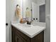 Bathroom vanity features a solid surface countertop, bronze faucet, and modern accessories at 1832 Farnham Dr, Ocoee, FL 34761