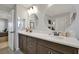 Modern bathroom featuring a double sink vanity, stylish mirrors, and a clean design at 1832 Farnham Dr, Ocoee, FL 34761