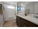 Stylish bathroom featuring a double sink vanity, tile floors, and a shower with tub at 1832 Farnham Dr, Ocoee, FL 34761