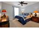Comfortable bedroom with ceiling fan showcasing a queen bed and side tables at 1832 Farnham Dr, Ocoee, FL 34761