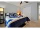 Comfortable bedroom with ceiling fan showcasing a decorative bed and closet at 1832 Farnham Dr, Ocoee, FL 34761