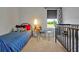 Bright bedroom featuring a twin bed, glass desk with a view, and a crib at 1832 Farnham Dr, Ocoee, FL 34761