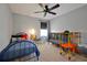 A bedroom with colorful toys, a toddler bed, and lots of natural light at 1832 Farnham Dr, Ocoee, FL 34761