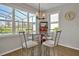 Cozy breakfast nook with lots of light, table and chairs at 1832 Farnham Dr, Ocoee, FL 34761