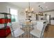 Bright breakfast nook with a glass table, comfortable chairs, and natural light at 1832 Farnham Dr, Ocoee, FL 34761