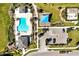 Aerial of community pool and playground featuring manicured lawns, lush landscaping, and convenient parking at 1832 Farnham Dr, Ocoee, FL 34761