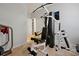 Well-equipped exercise room with weight machines and a mounted television at 1832 Farnham Dr, Ocoee, FL 34761