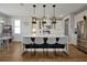 Spacious kitchen with a large island, stainless steel appliances, and modern pendant lighting at 1832 Farnham Dr, Ocoee, FL 34761