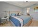 Calm main bedroom showcasing a blue and gray bed set and neutral walls at 1832 Farnham Dr, Ocoee, FL 34761