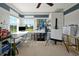 Sunlit office with white cabinets, multiple work surfaces, and an easel for painting at 1832 Farnham Dr, Ocoee, FL 34761