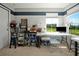 Well-organized office featuring a white work surface, shelving, and a large window at 1832 Farnham Dr, Ocoee, FL 34761