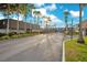 Gated community entrance with manicured landscaping and a row of townhomes at 1926 S Conway Rd # 12, Orlando, FL 32812