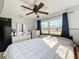 Bright bedroom with a ceiling fan and large windows overlooking the front yard at 200 Dr Martin Luther King Jr Se St, Fort Meade, FL 33841